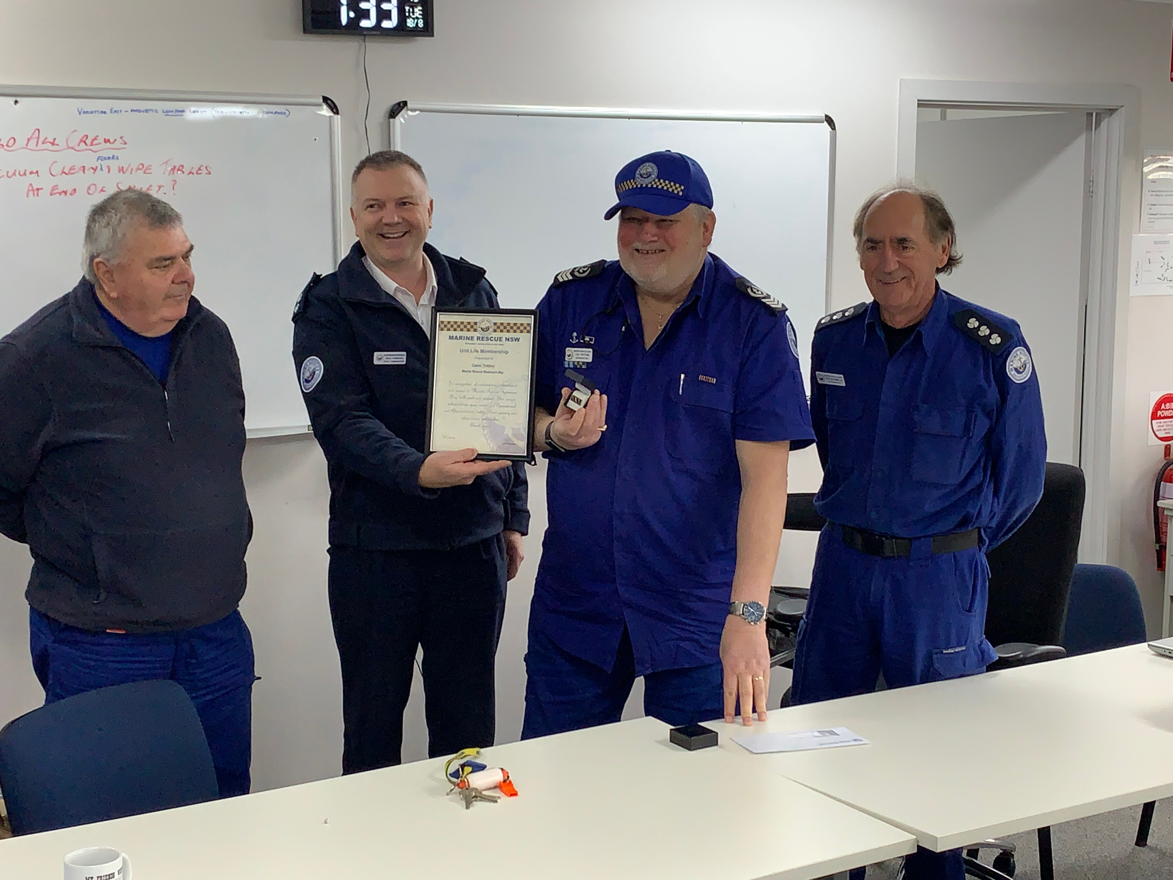 Colin Tritton receiving his Unit Life Membership from Zone Commander Michael Hammond and Unit Commander Rod Ingamells